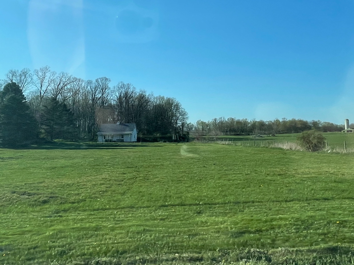 farmhouse-with-surrounding-trees