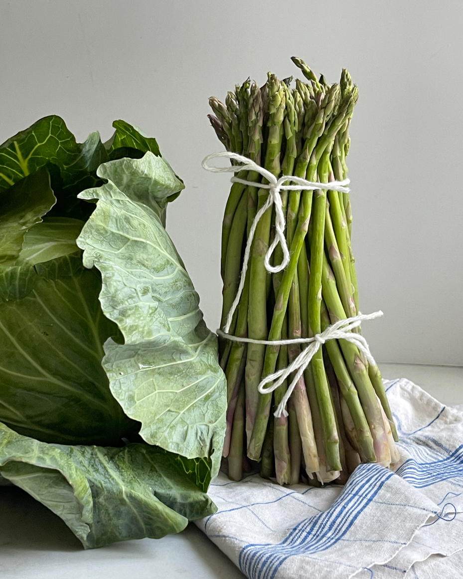close-up-of-standing-asparagus-and-cabbage