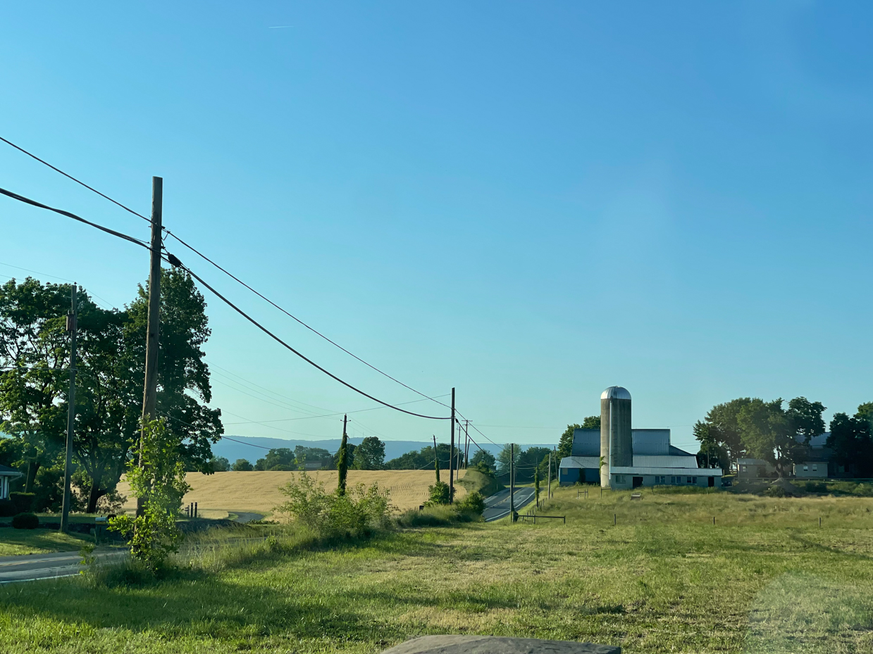 farmhouse-with-road-and-power-lines