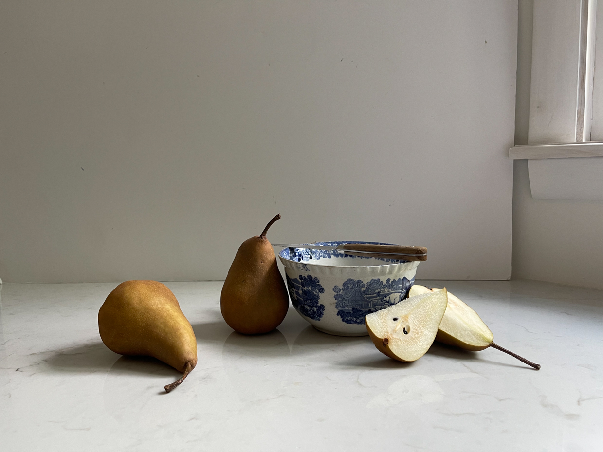 two-pears-next-to-bowls