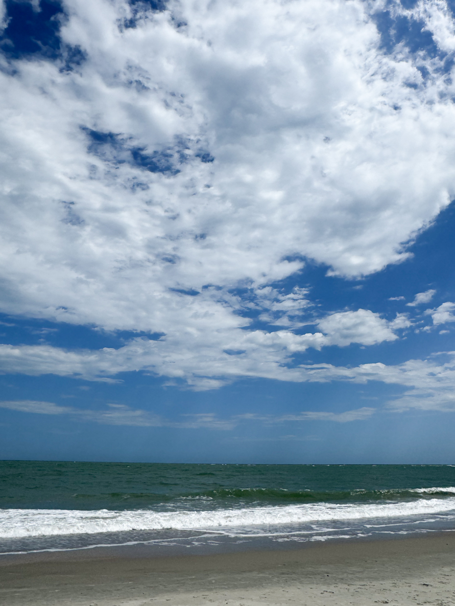 beach-sand-with-waves-and-clouds