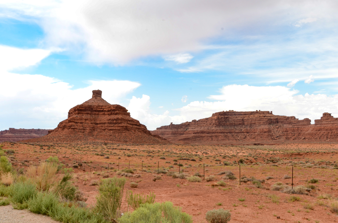 red-rock-butte-and-mesa-in-desert-landscape-with-blue-sky