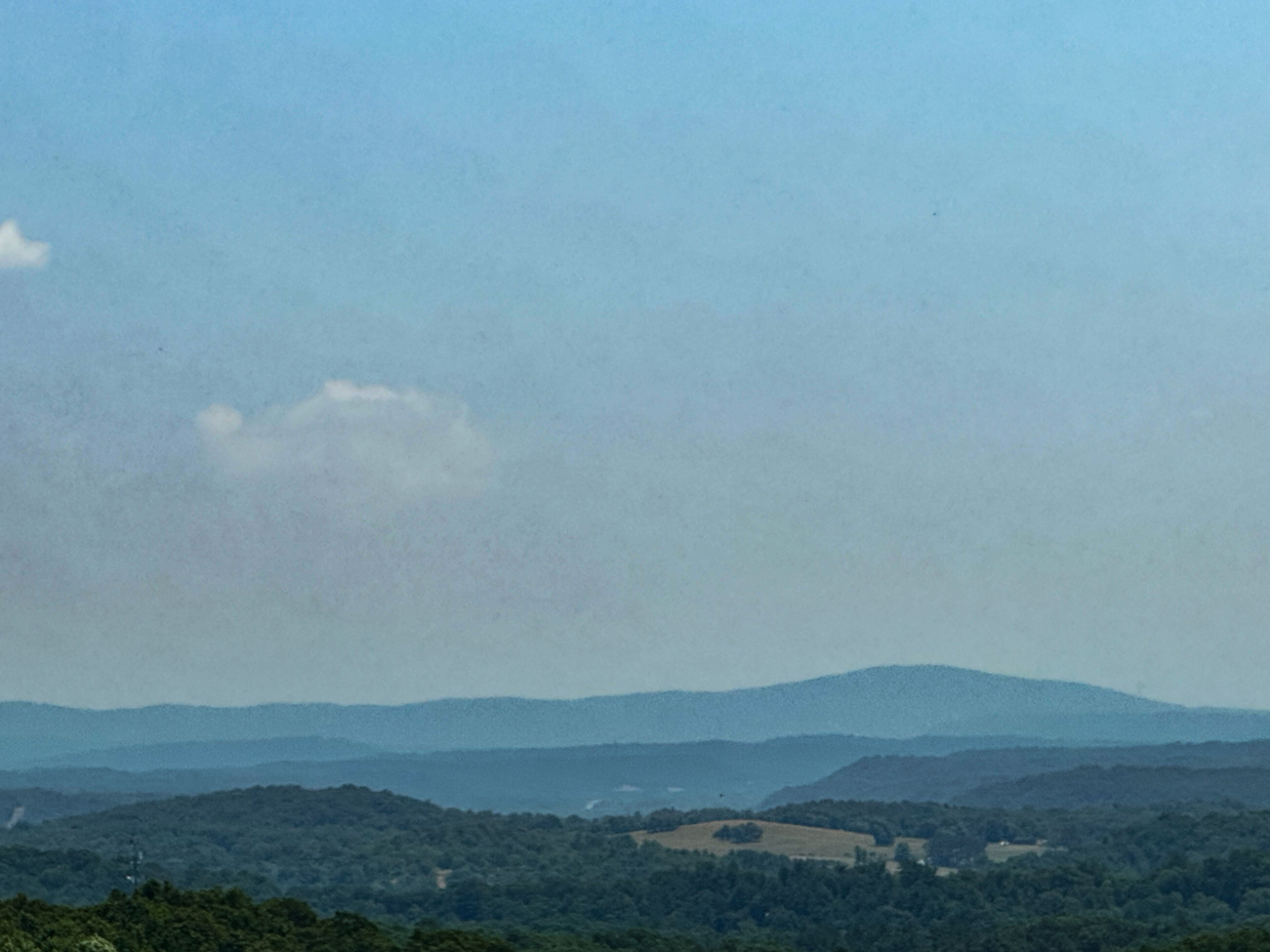 scenic-blue-green-mountainous-landscape-rolling-hills-forested-peaks-rural-nature