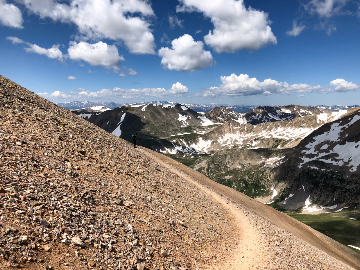 high-alpine-trail-with-stunning-mountain-views-and-snow-capped-peaks