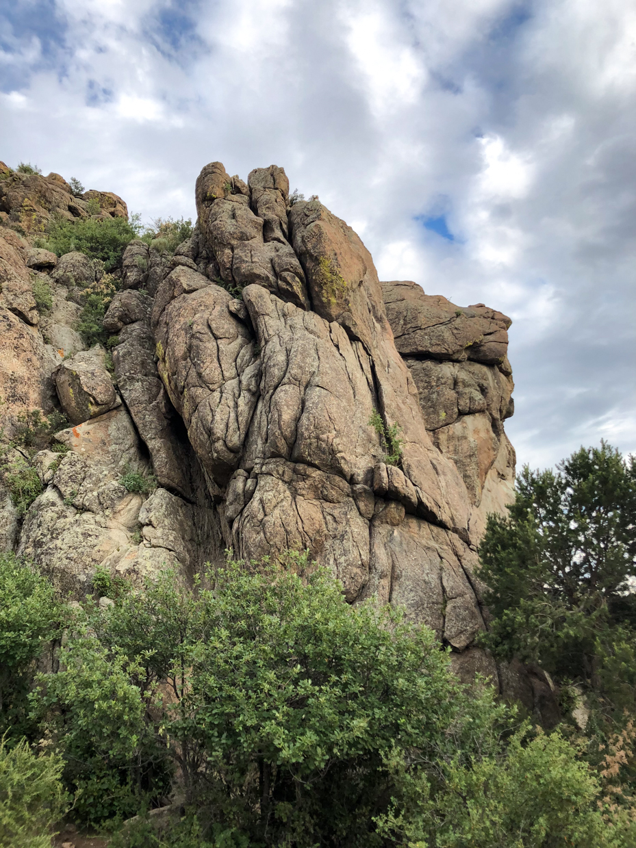 rugged-granite-cliffs-with-verdant-foliage-dramatic-rock-formation-artist-reference-photo