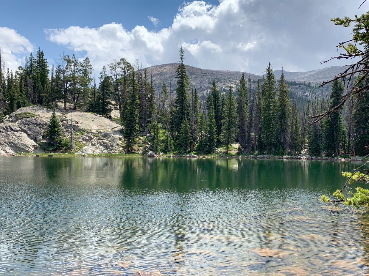 serene-alpine-lake-with-evergreen-pines-tranquil-nature-landscape-photography