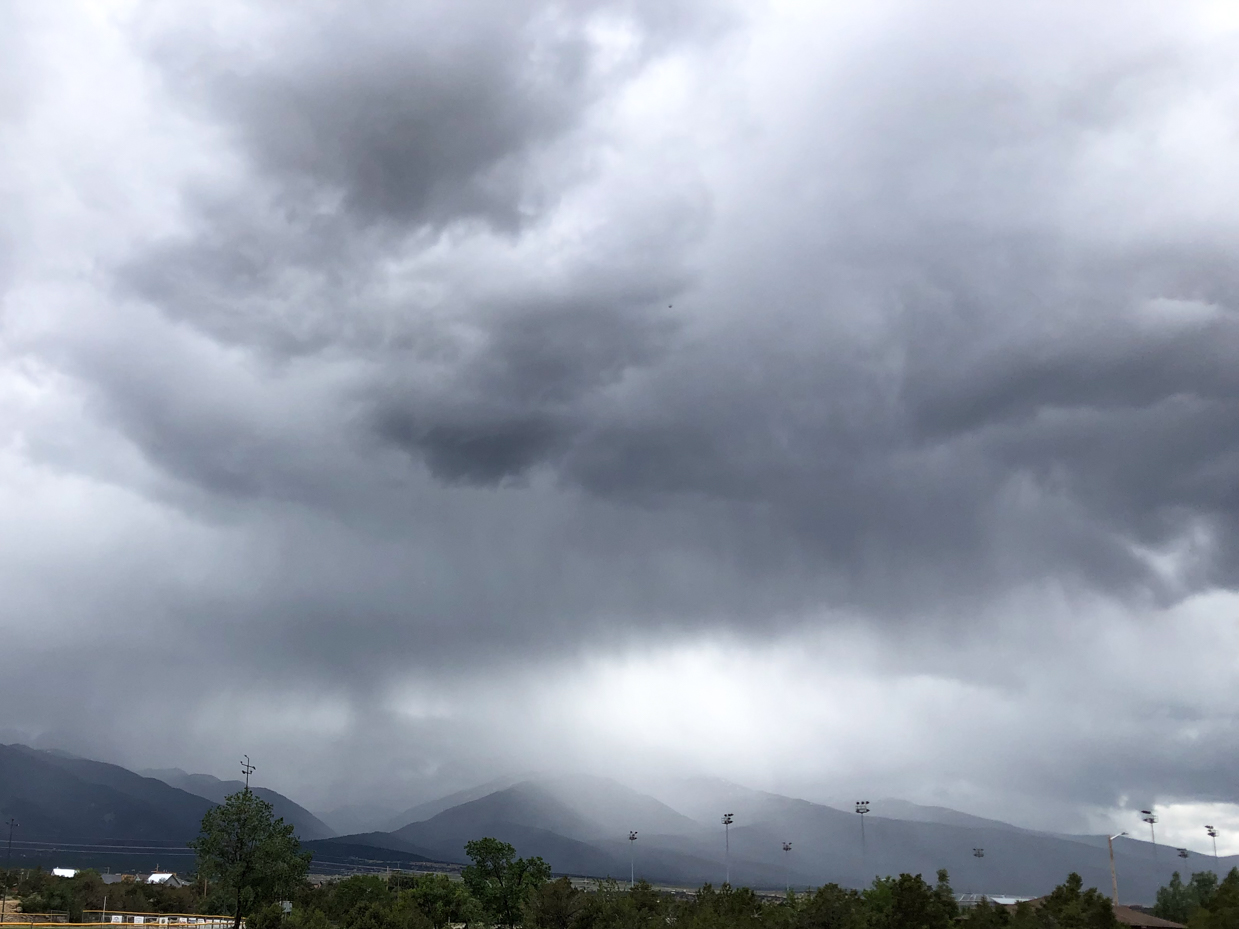 storm-clouds-over-mountain-range-dramatic-weather-photography-with-dark-sky-and-thunderstorm