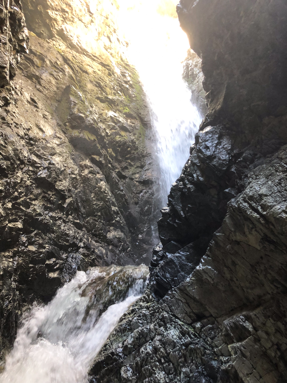 waterfall-cascading-through-rocky-canyon-stunning-nature-photography-in-narrow-gorge