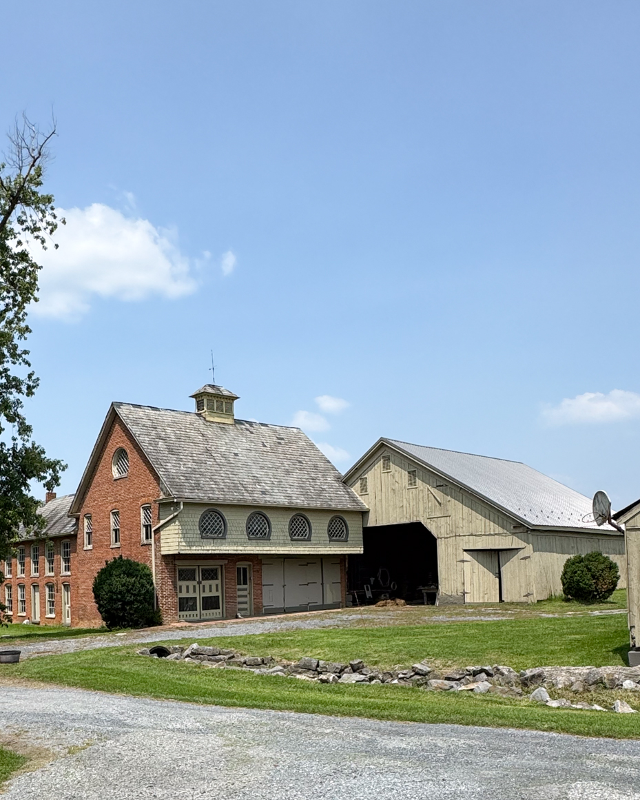 historic-farm-compound-brick-carriage-house-rustic-barns-rural-architecture