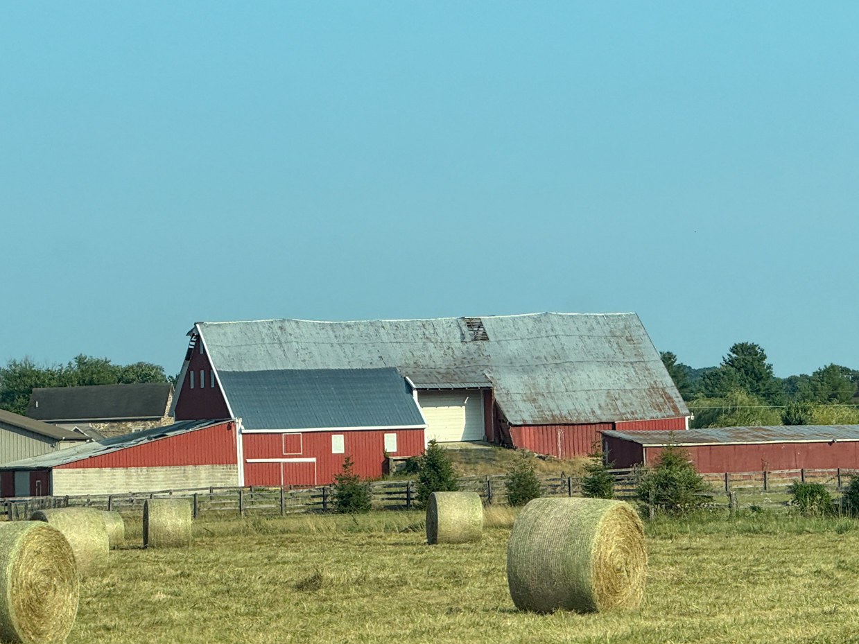 red-barn-with-hay-bales