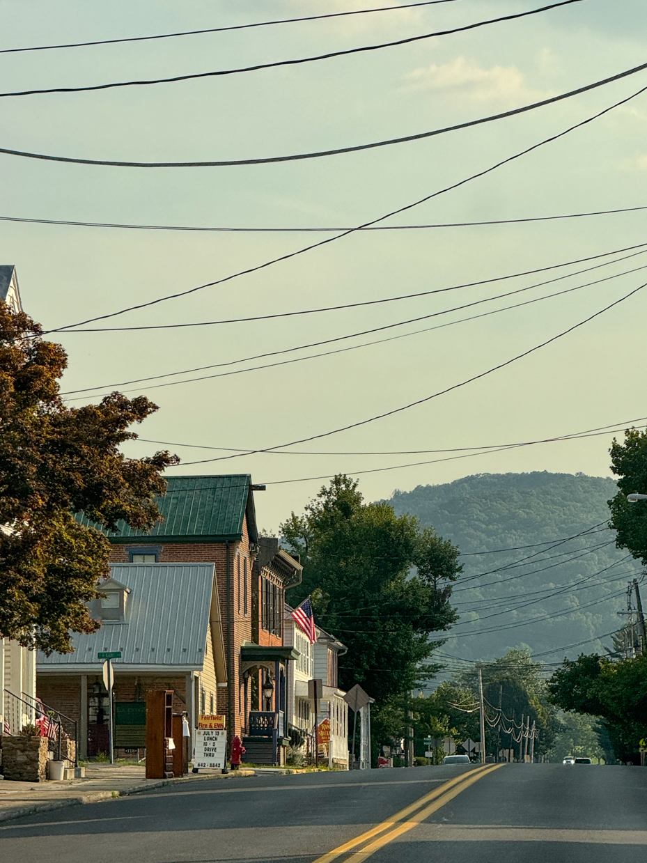 small-town-street-with-flag-and-mountain