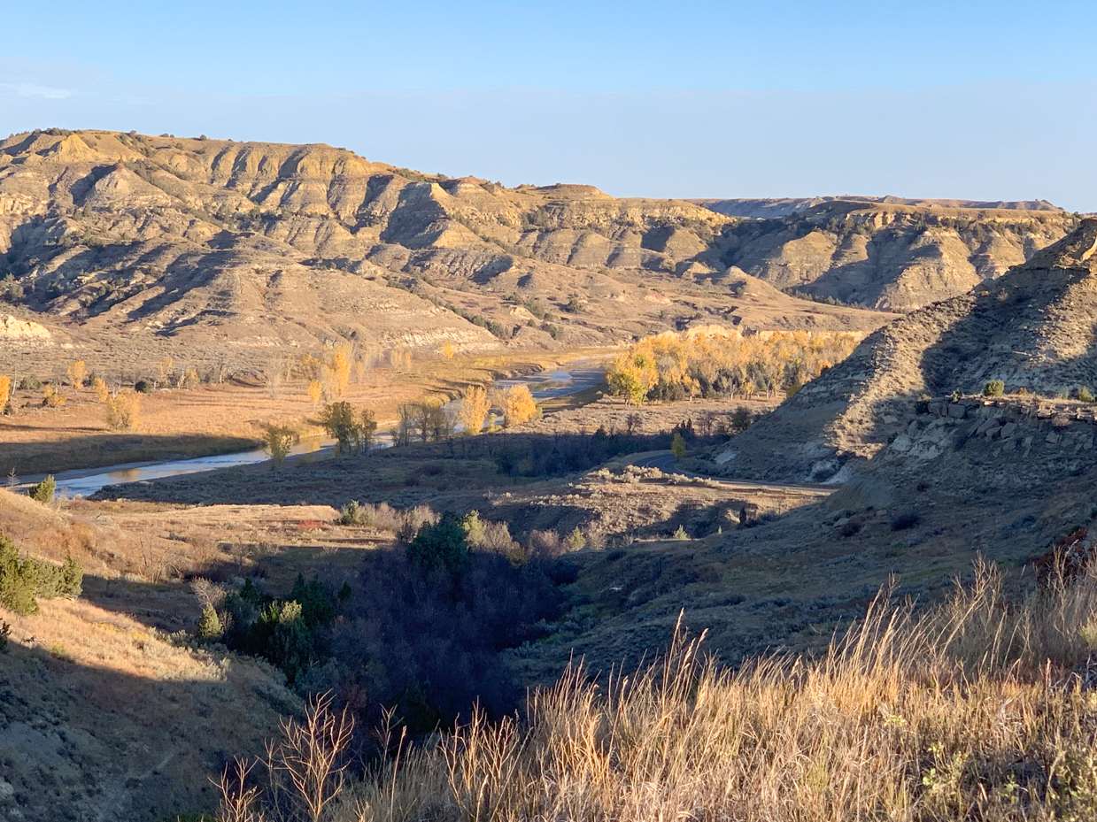 sunlit-badlands-with-autumn-river-valley-western-landscape-artist-reference