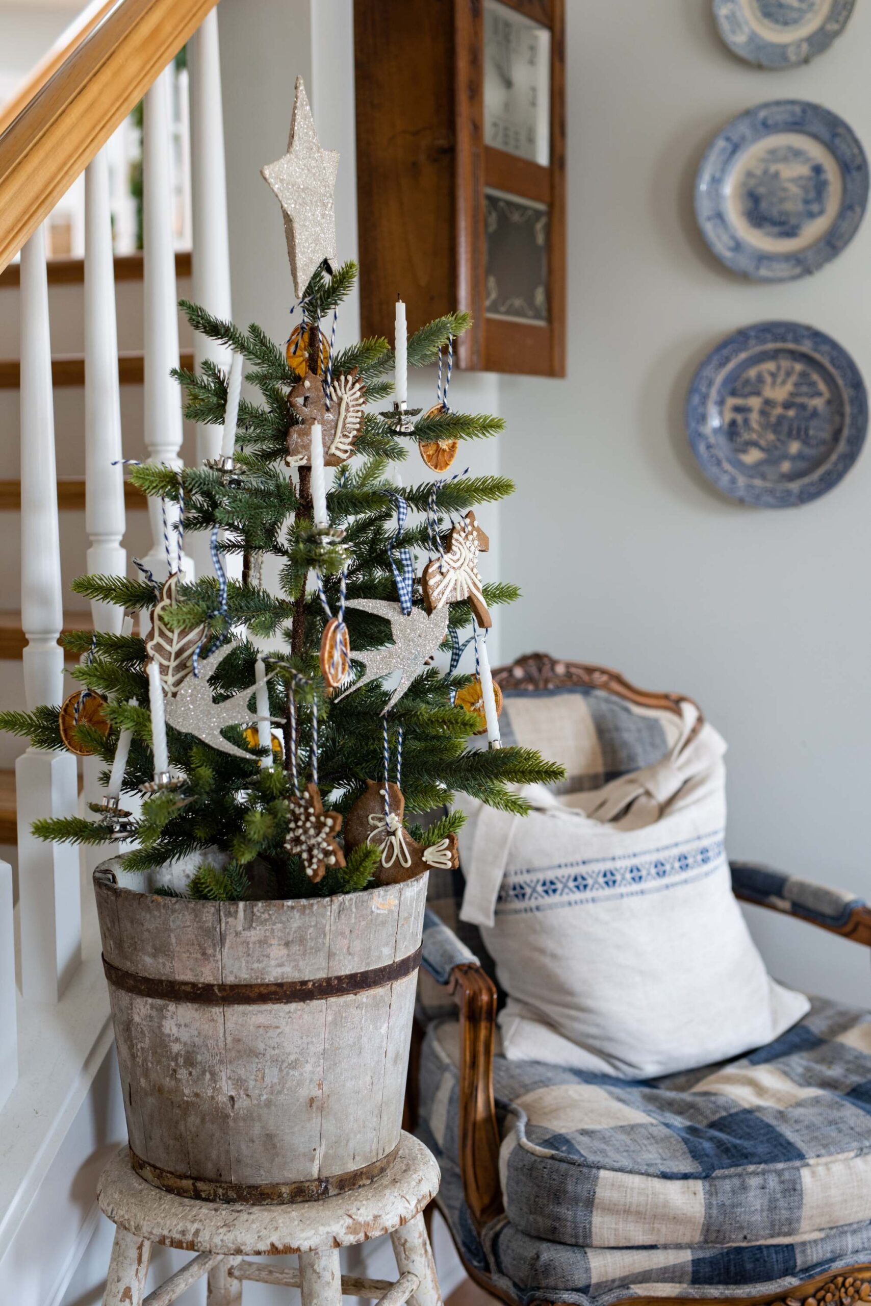 Charming rustic Christmas tree in wooden barrel planter by cozy reading nook artist reference photo