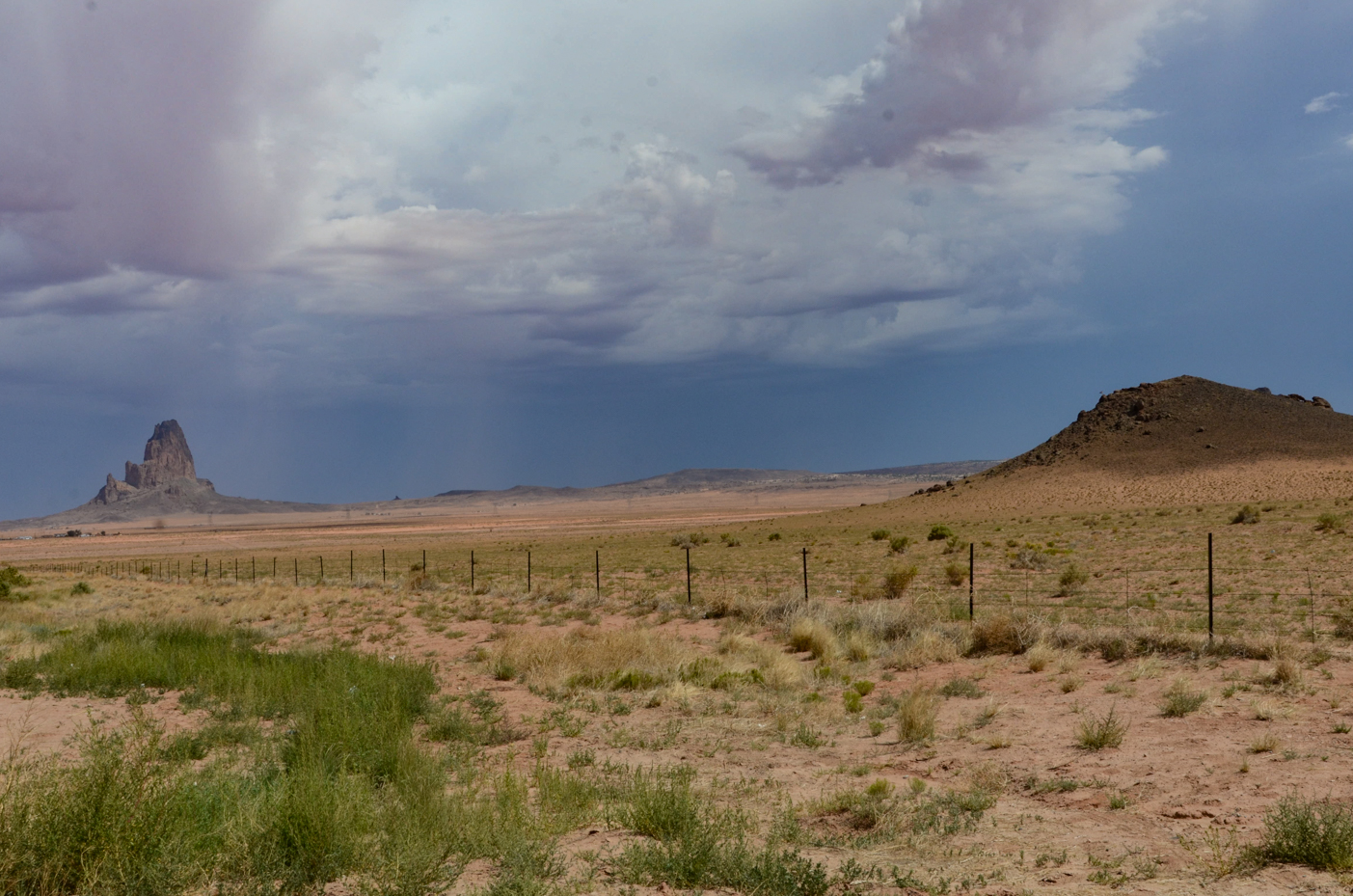 dramatic-shiprock-vista-across-desert-plains-with-stormy-sky-in-new-mexico