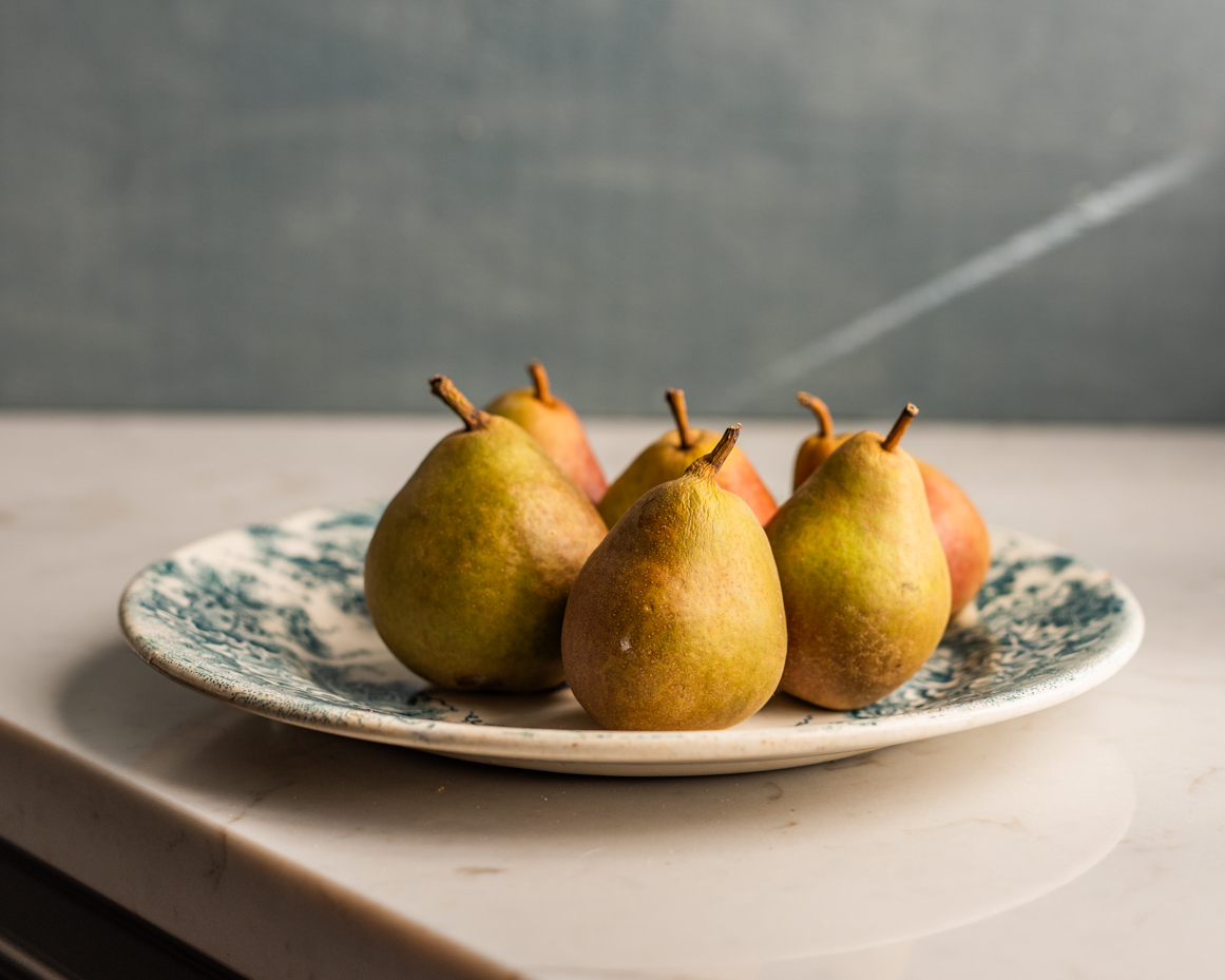 ripe-pears-on-rustic-plate-with-soft-lighting-artist-reference-photo