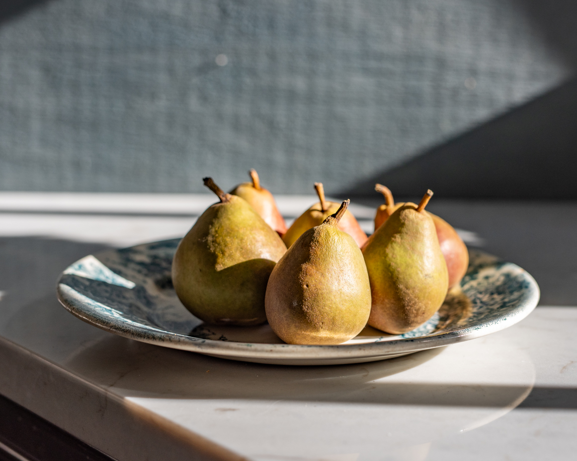 ripe-pears-on-vintage-patterned-plate-in-natural-light-artist-reference-photo