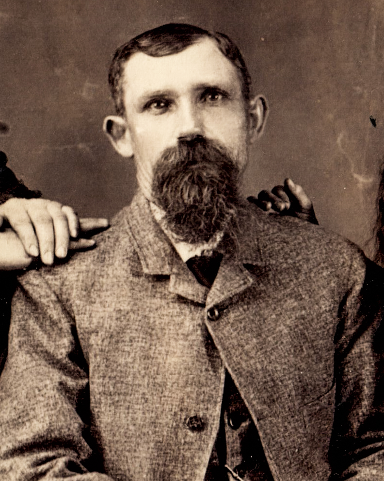 vintage-portrait-of-a-bearded-man-in-a-textured-suit