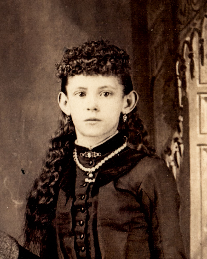 vintage-portrait-of-a-young-girl-in-victorian-dress-with-curly-hair-and-jewelry