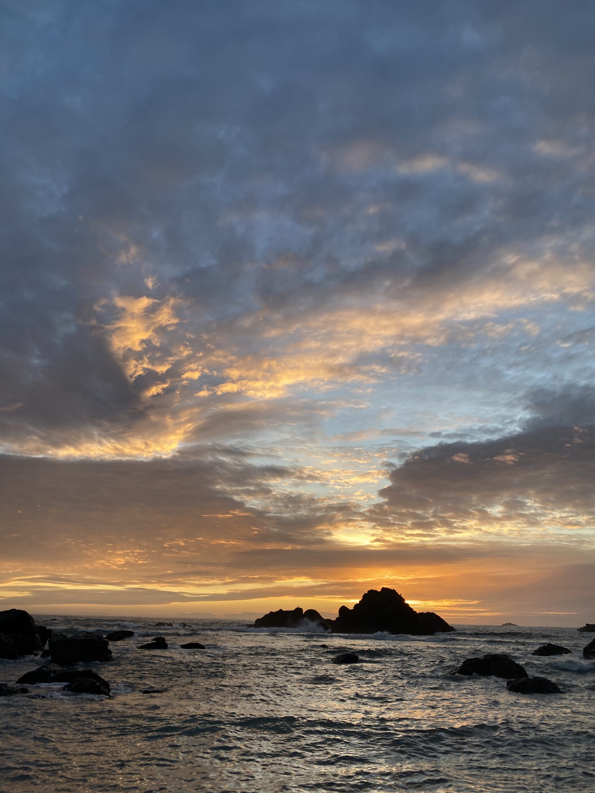 dramatic-ocean-sunset-with-rocky-silhouettes-and-colorful-sky