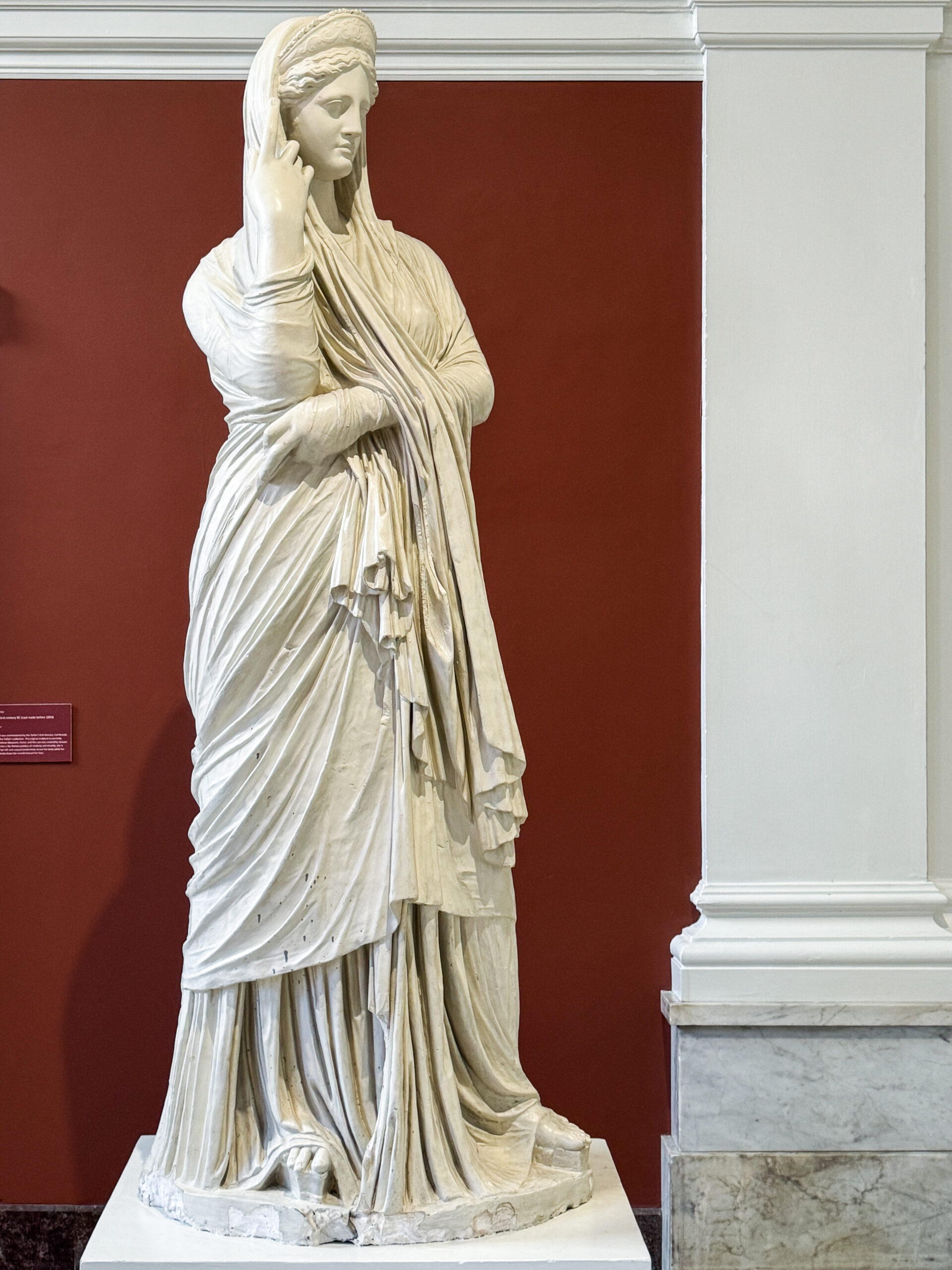 full-length-marble-statue-of-a-veiled-woman-with-flowing-drapery-and-elegant-pose