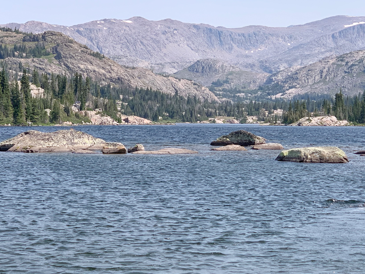 glacial-lake-with-submerged-boulders-rugged-mountain-landscape-artist-reference-photo