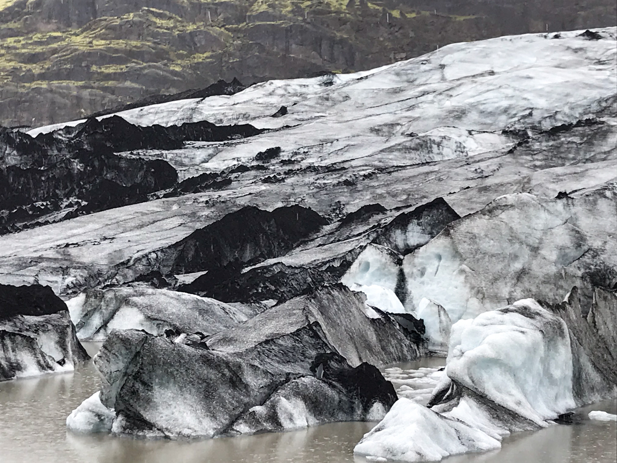 majestic-glacier-with-black-and-white-ice-formations-in-a-pristine-valley-icelandic-nature-photography