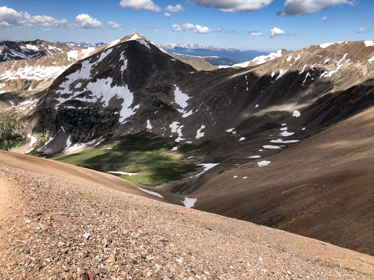 majestic-mountain-landscape-with-snow-patches-and-rocky-slopes