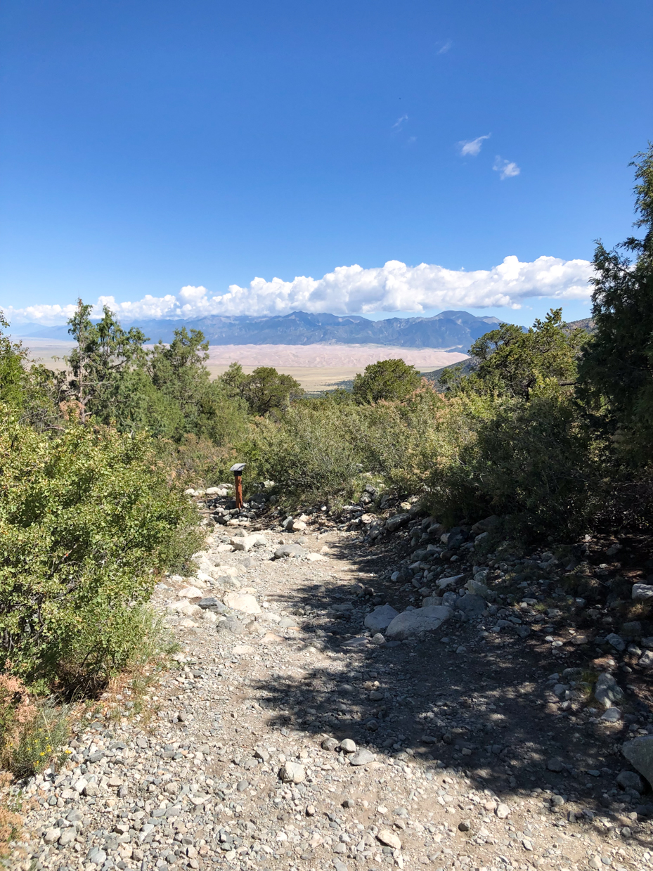 mountain-trail-with-rocky-terrain-and-scenic-distant-desert-view