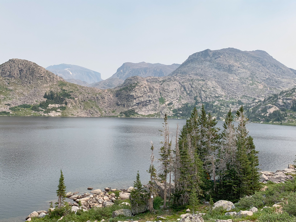 pristine-alpine-lake-surrounded-by-rugged-mountains-scenic-high-altitude-wilderness-landscape-artist-reference-photo