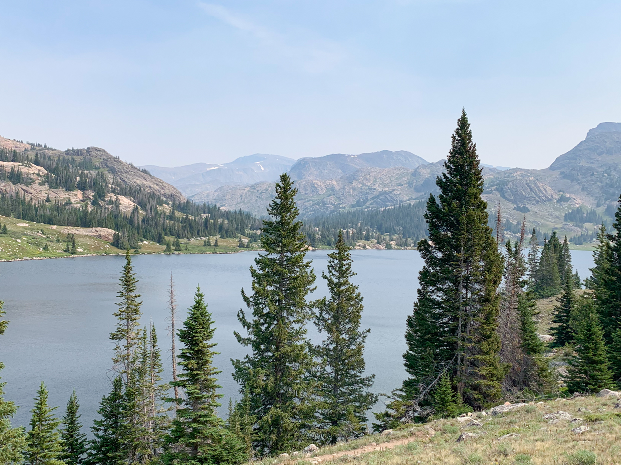 serene-alpine-lake-surrounded-by-rugged-peaks-high-altitude-wilderness-landscape-artist-reference-photo