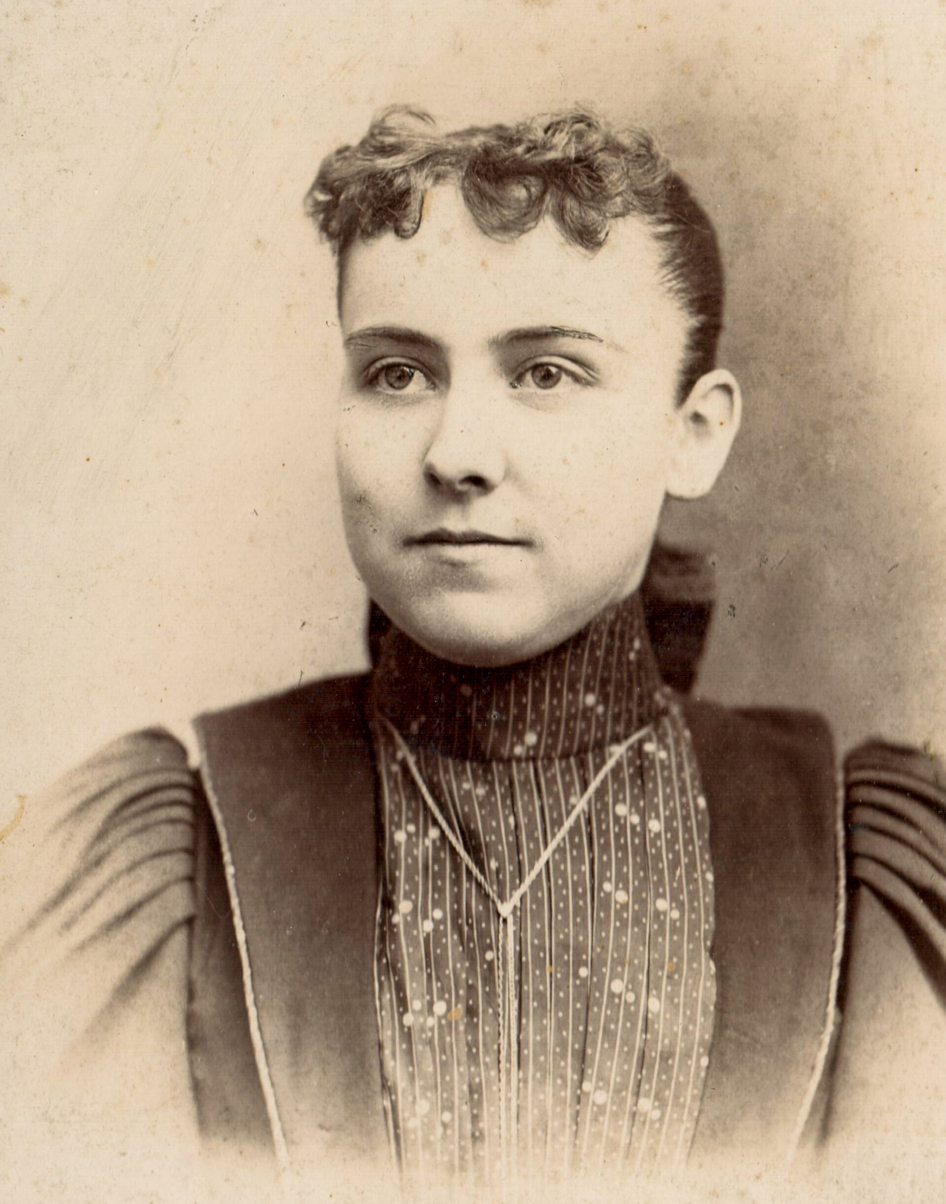 portrait-of-a-woman-with-curly-bangs