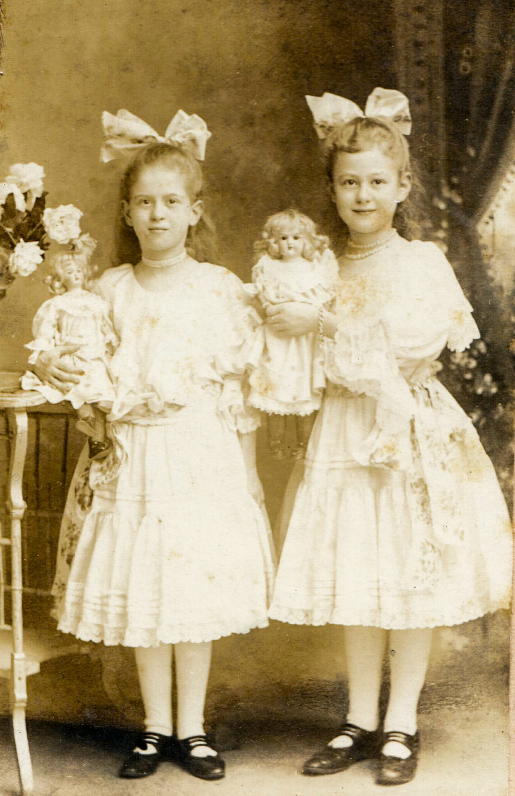 portrait of two girls in white dresses with matching dolls artist reference photo