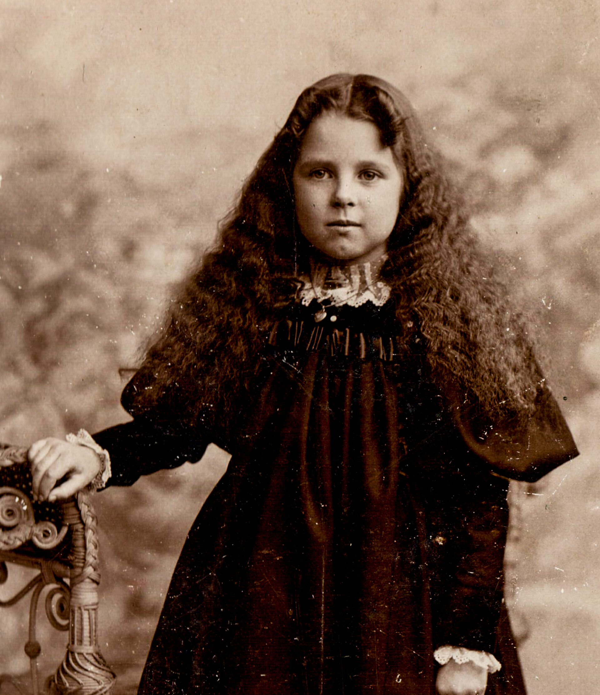 portrait-of-girl-with-dark-curly-hair