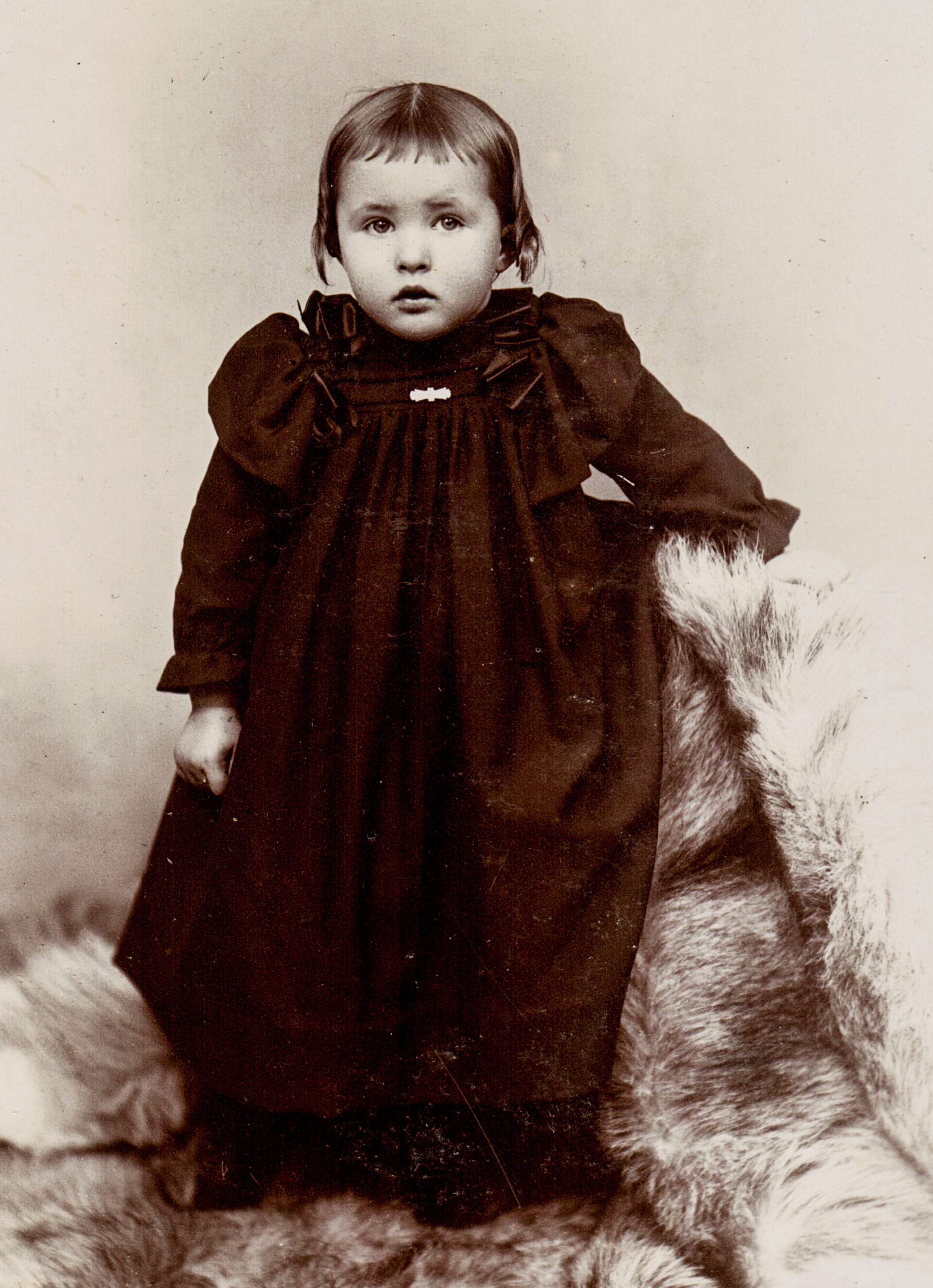 portrait-of-toddler-in-black-dress