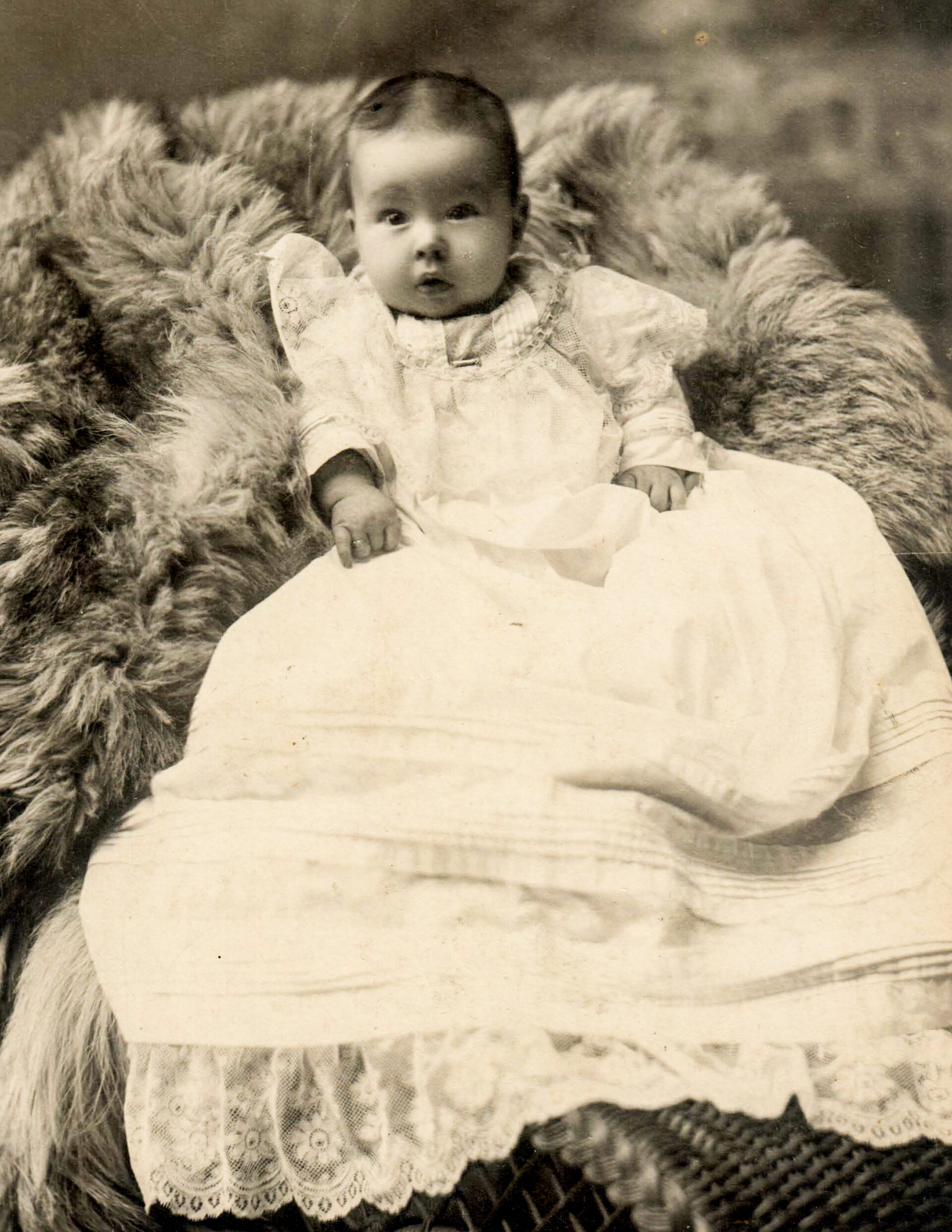 portrait-of-baby-in-long-white-dress