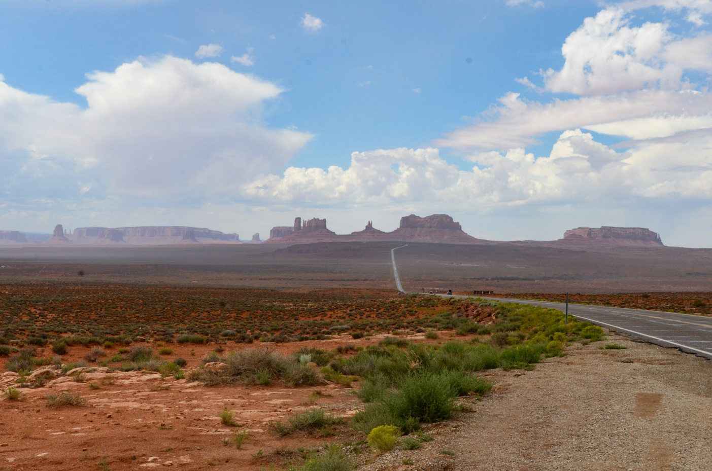 picturesque-monument-valley-drive-with-open-desert-and-blue-skies