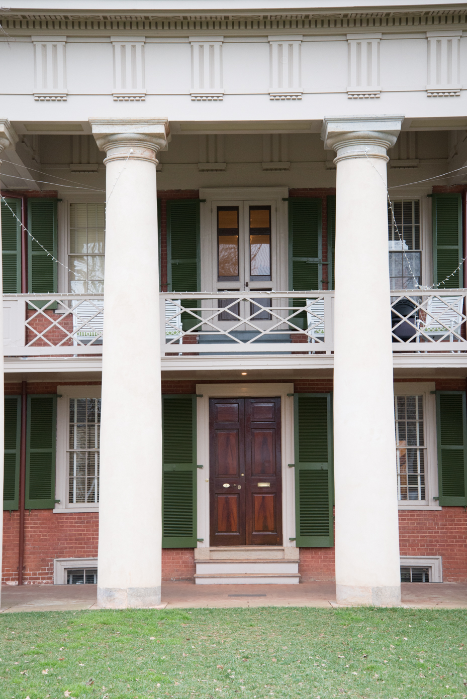 southern-mansion-entrance-classical-portico-with-ionic-columns-double-height-veranda-and-decorative-balustrades