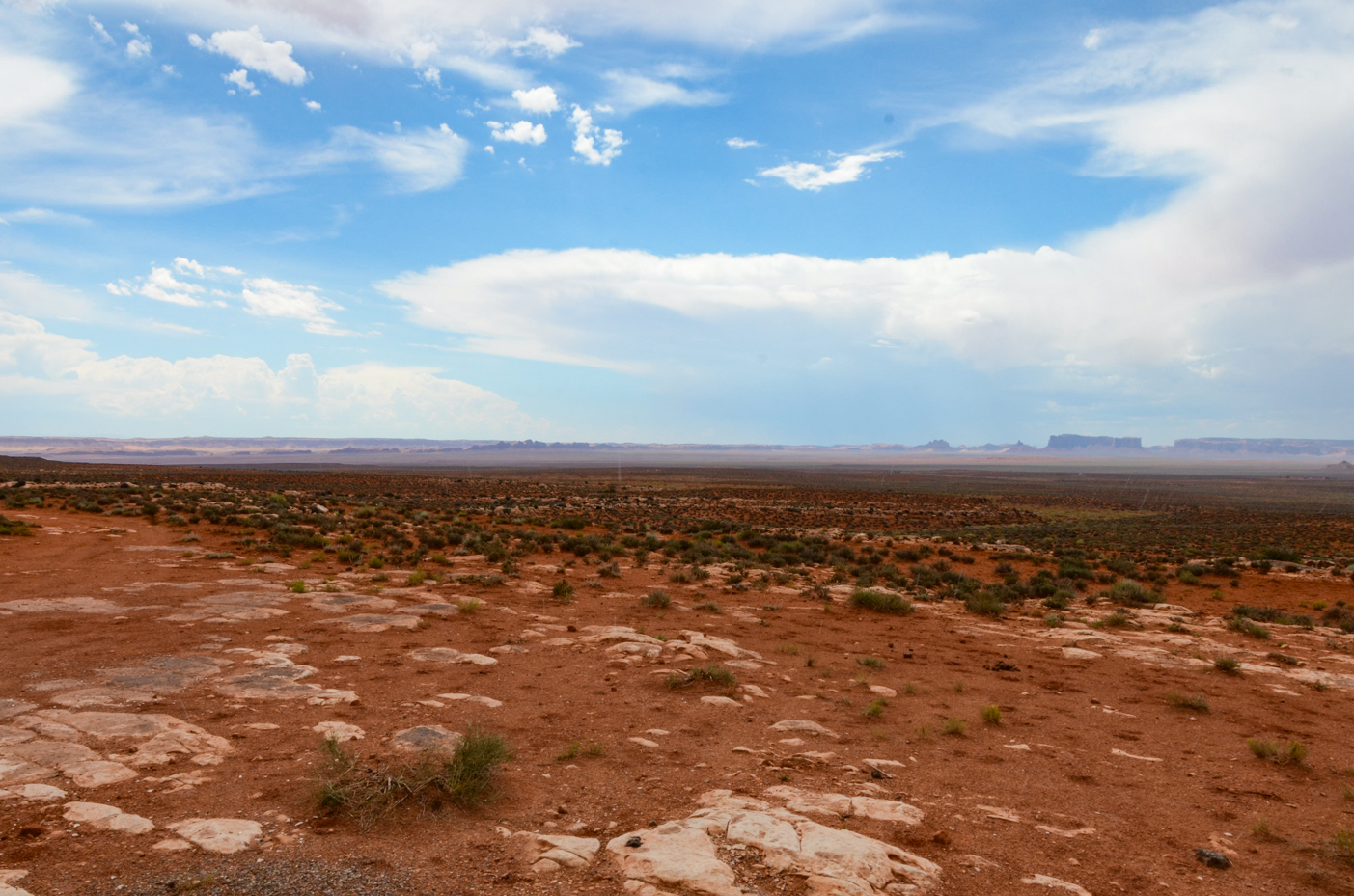 vast-desert-landscape-with-distant-monument-valley-horizon