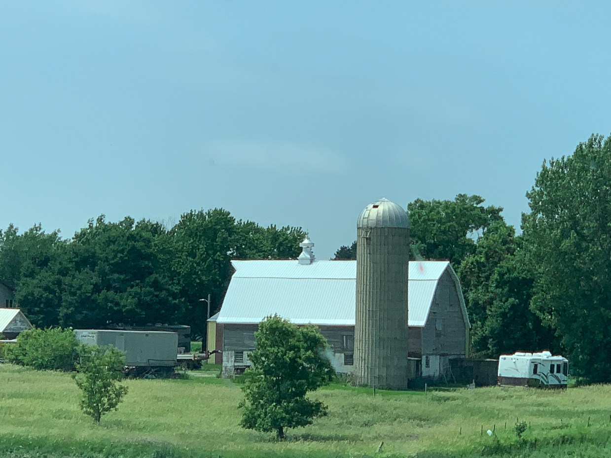 classic-farmstead-with-barn-silo-and-lush-green-fields-rural-tranquility