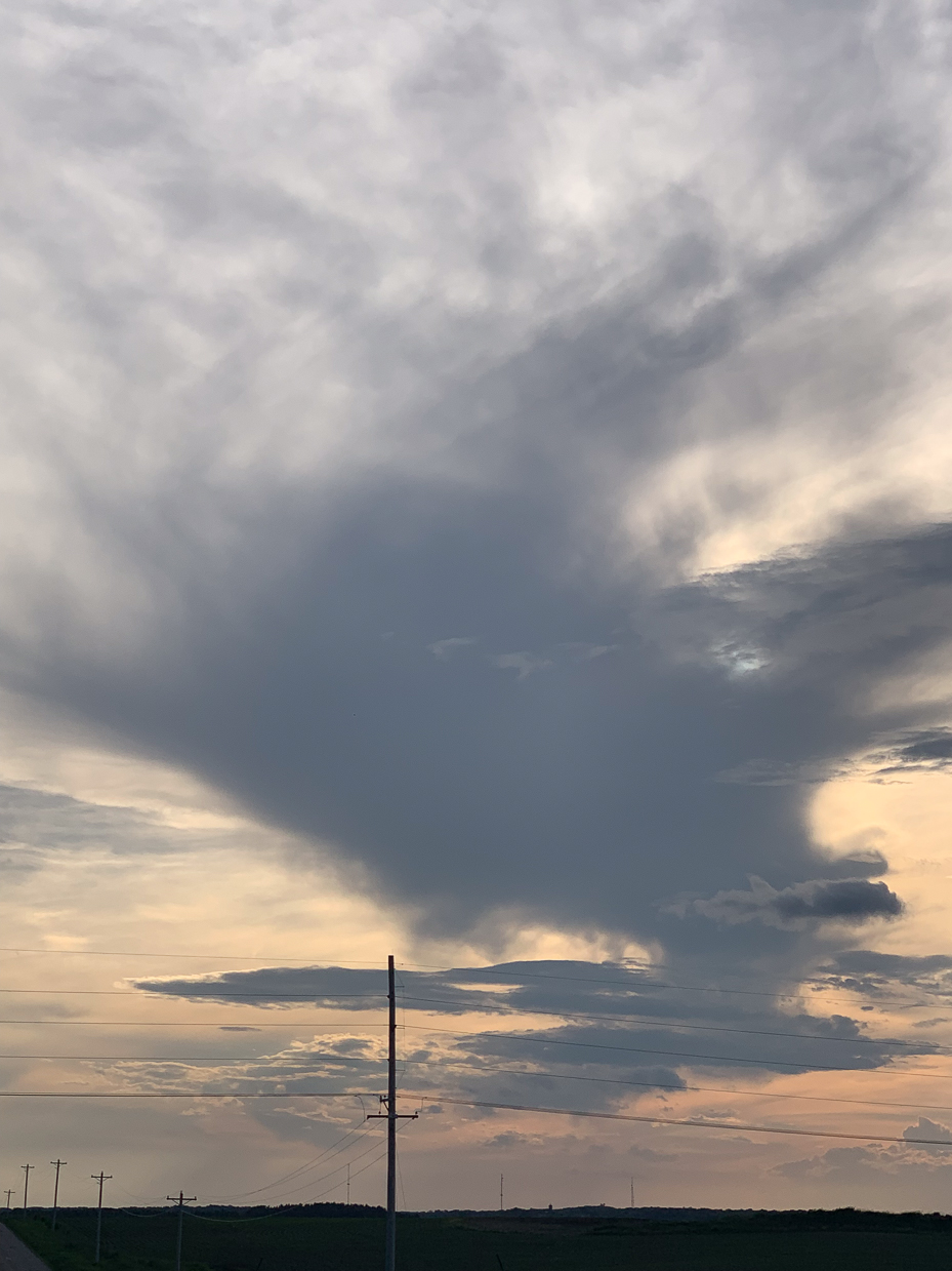 moody-sky-with-dramatic-clouds-over-a-rural-landscape-at-sunset-serene-evening-view