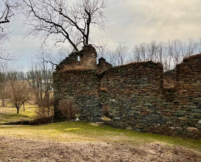 ancient-stone-ruins-winter-landscape-bare-trees-historic-architecture