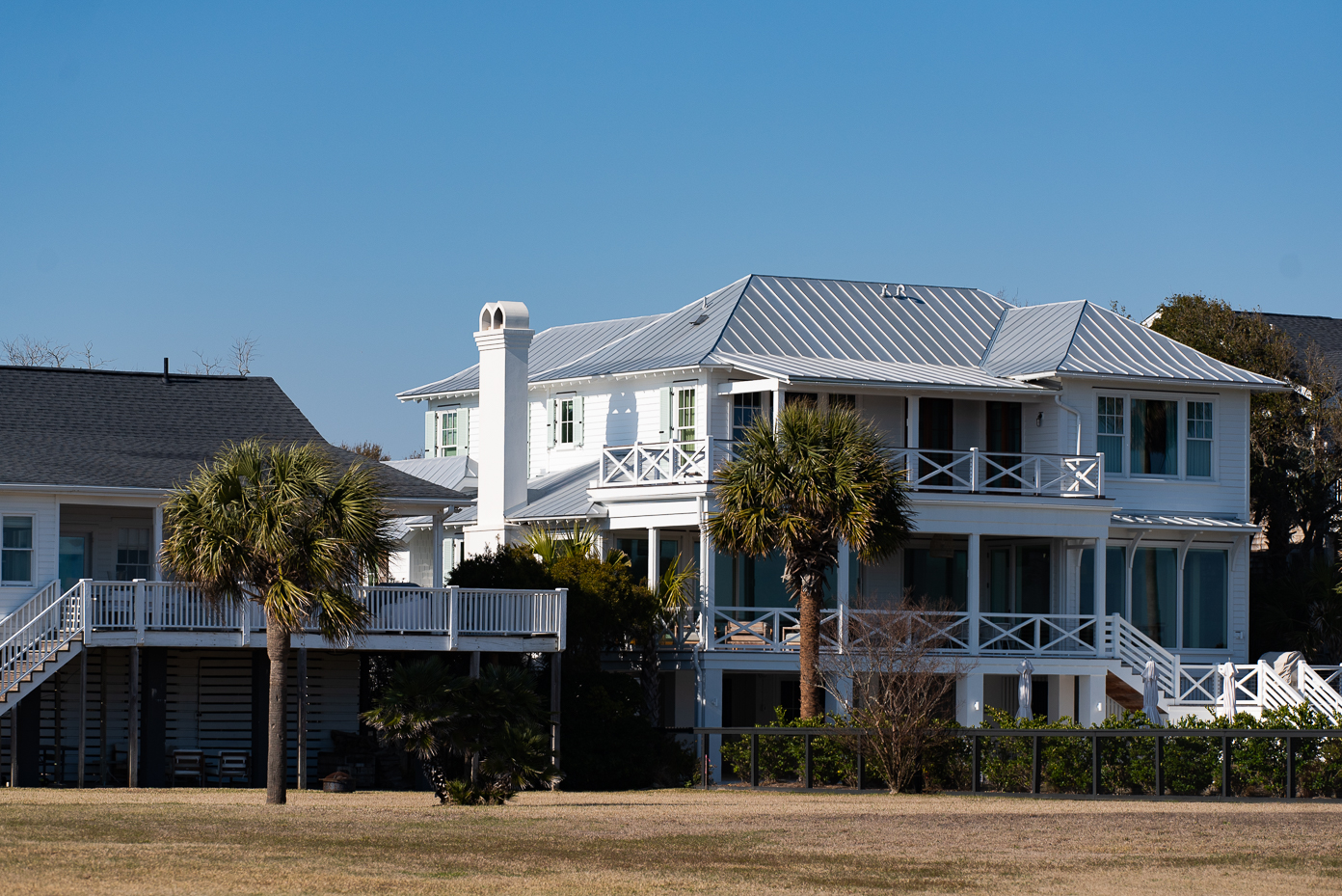 elegant-seaside-home-with-metal-roof-and-tropical-landscaping