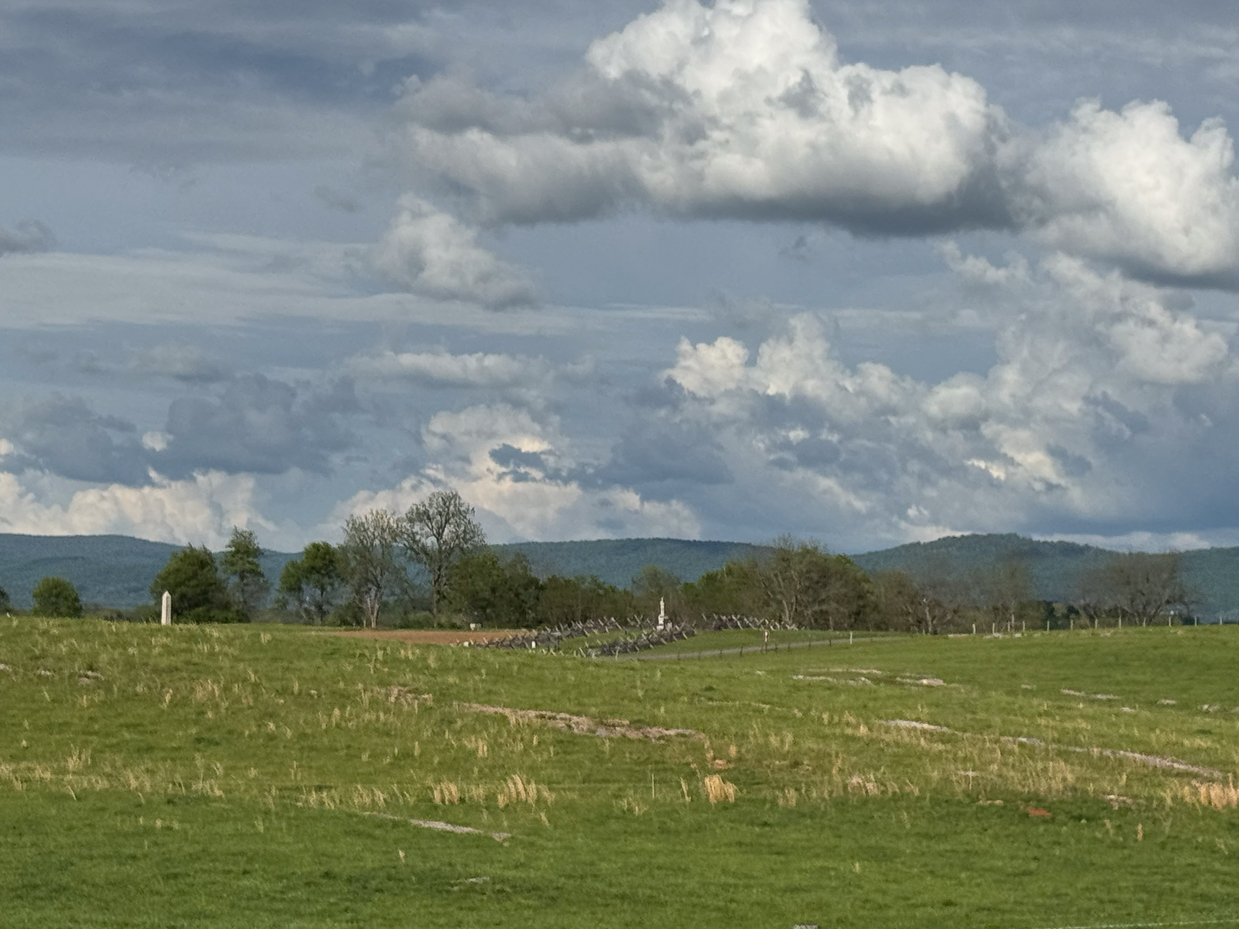 civil-war-era-split-rail-fence-and-rolling-hills-under-dramatic-cloudscape-artist-reference-photo