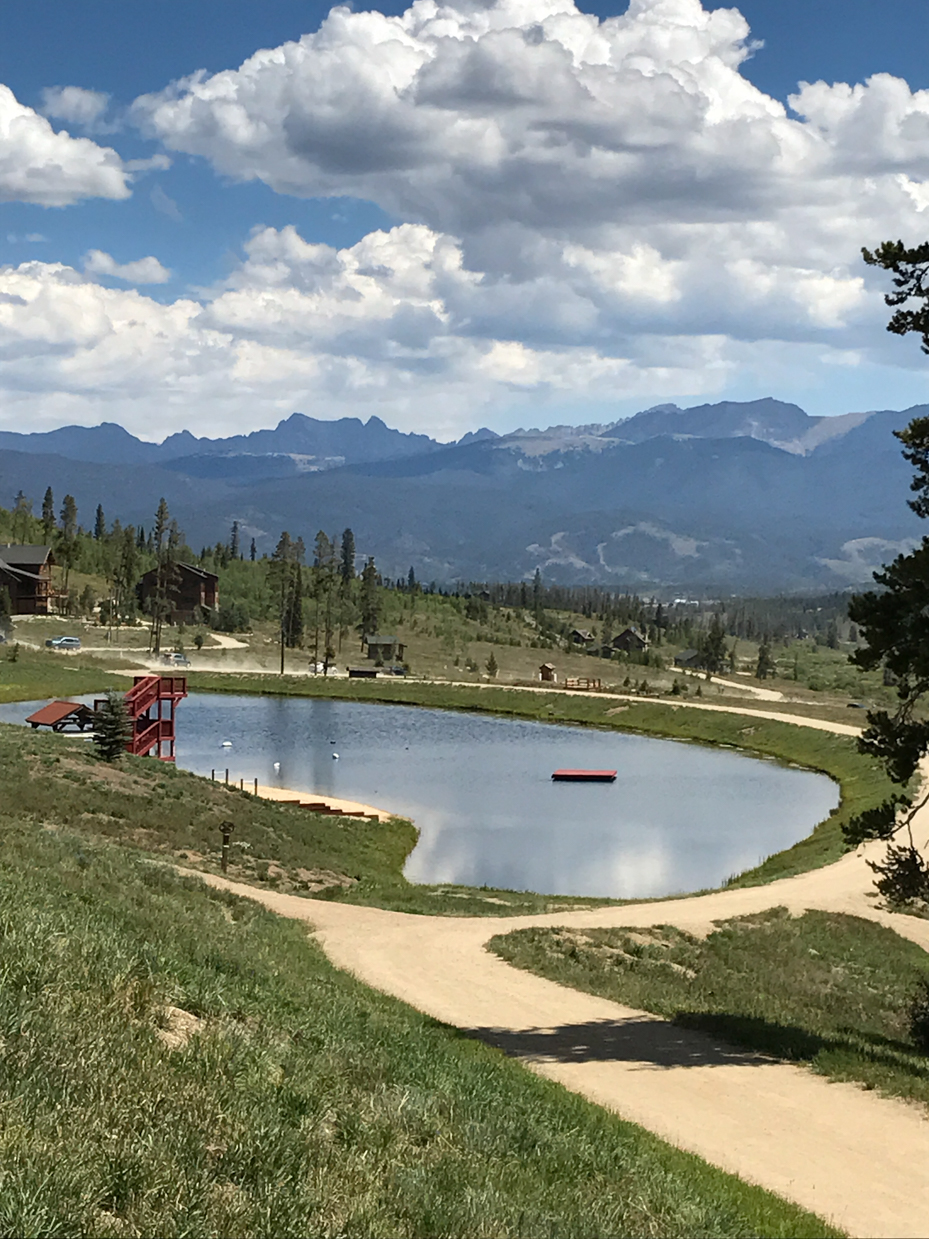 scenic-mountain-lake-with-dock-and-summer-landscape