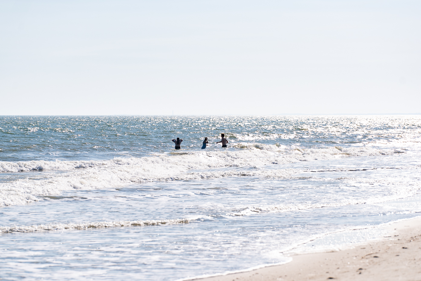 kids-playing-in-ocean-waves-south-carolina-beach-sunny-afternoon-coastal-vacation-fun