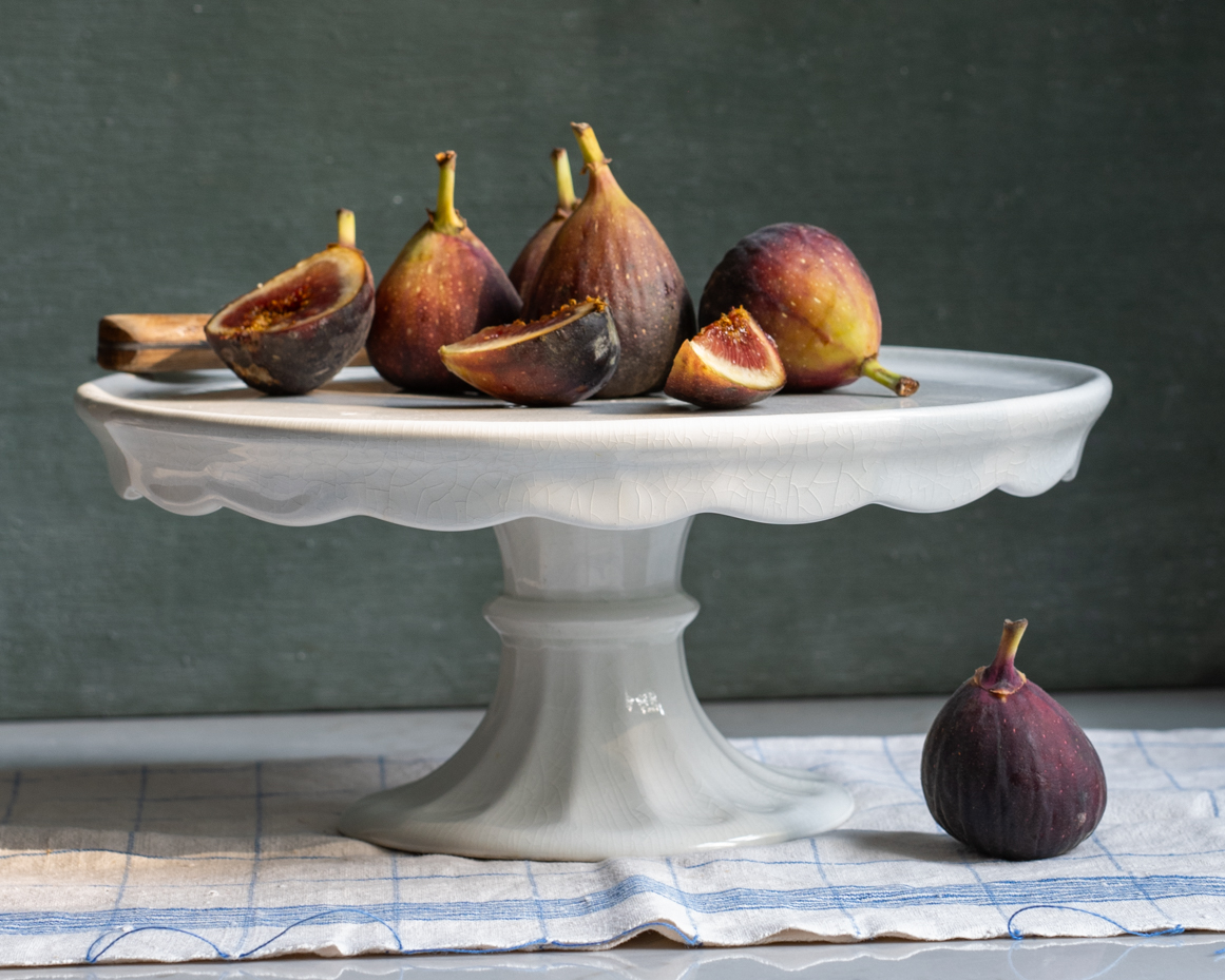 ripe-figs-on-white-pedestal-with-rustic-knife-and-linen-towel-artist-reference-photo