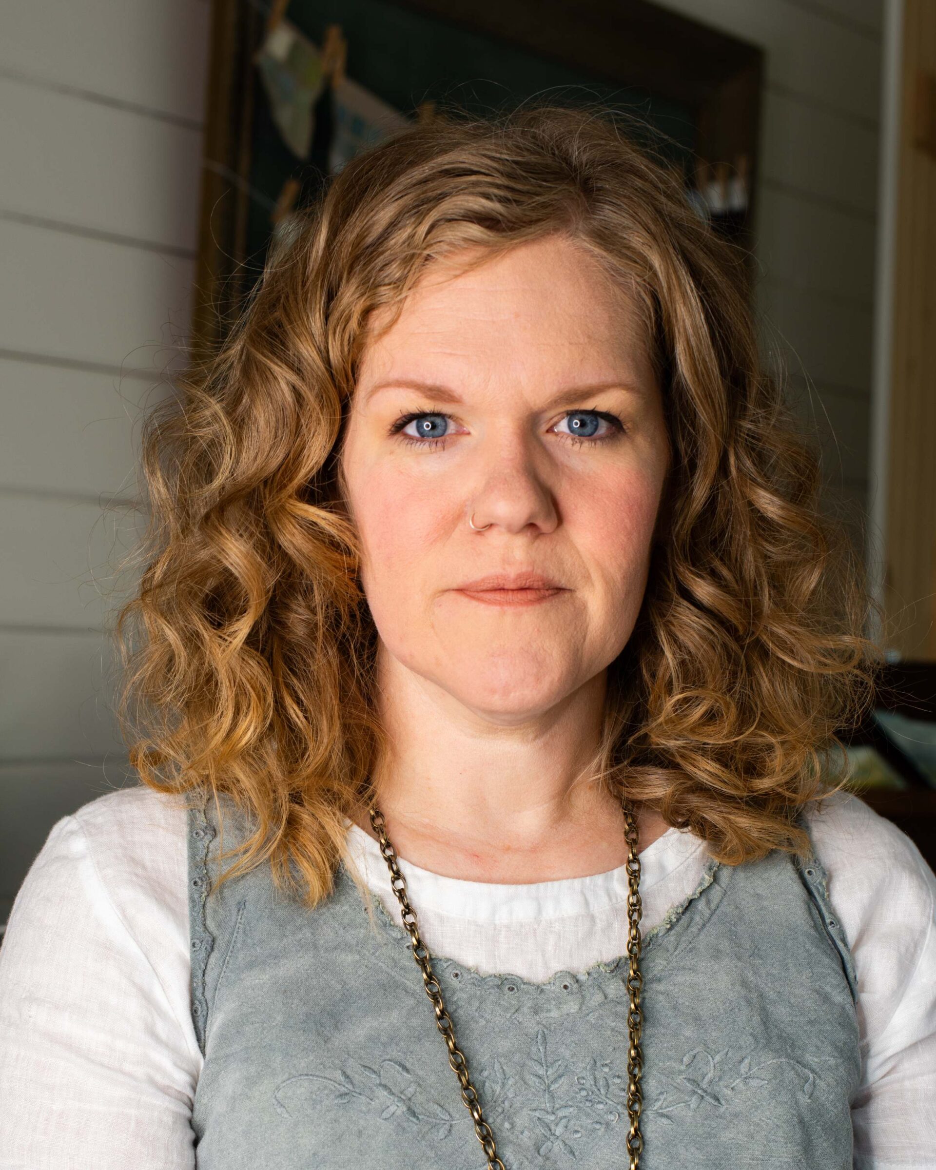 woman-with-curly-blonde-hair-and-blue-eyes-in-natural-light-portrait-artist-reference-photo