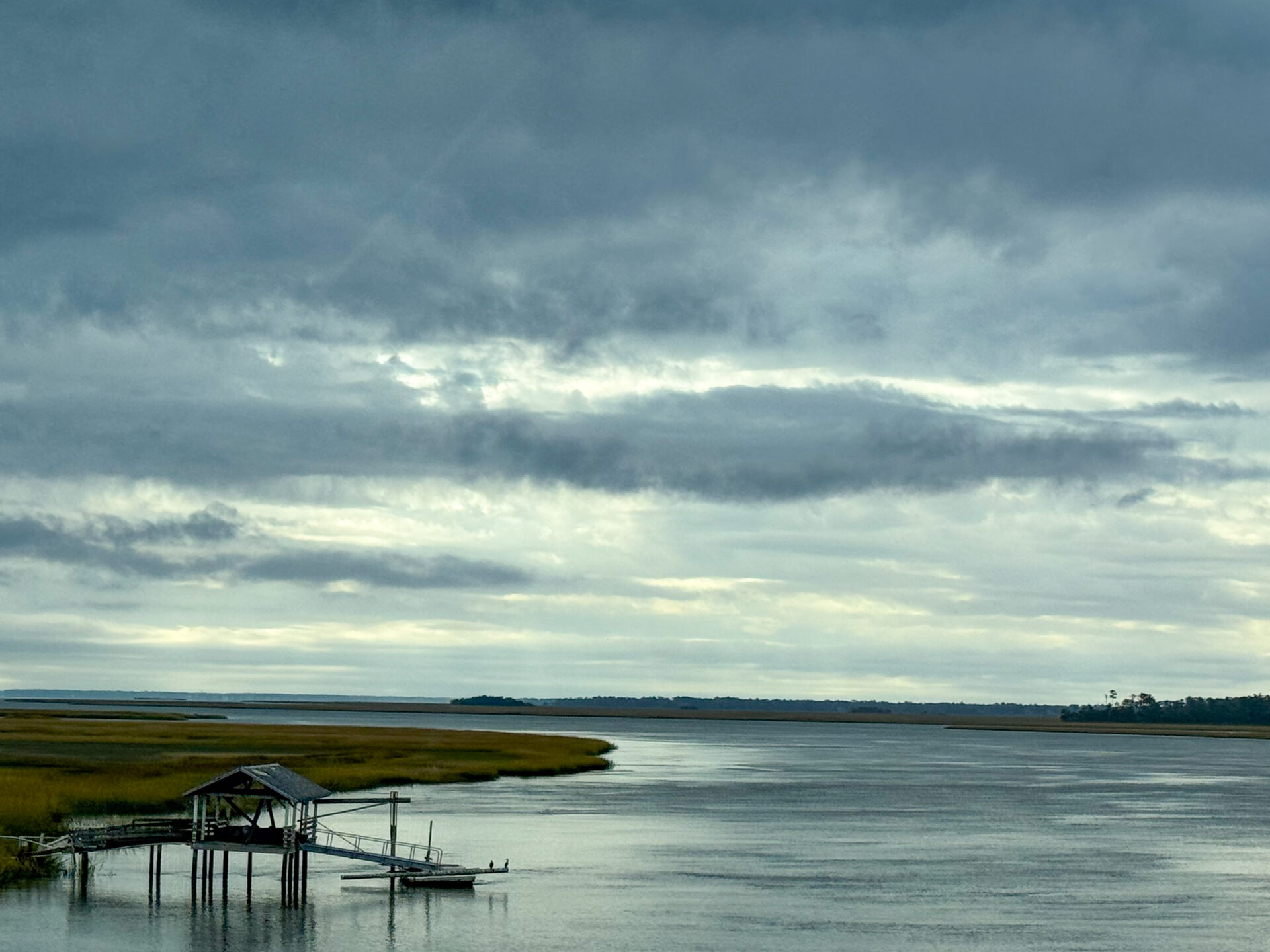 abandoned-dock-on-curving-marsh-river-under-stormy-sky-artist-reference-photo