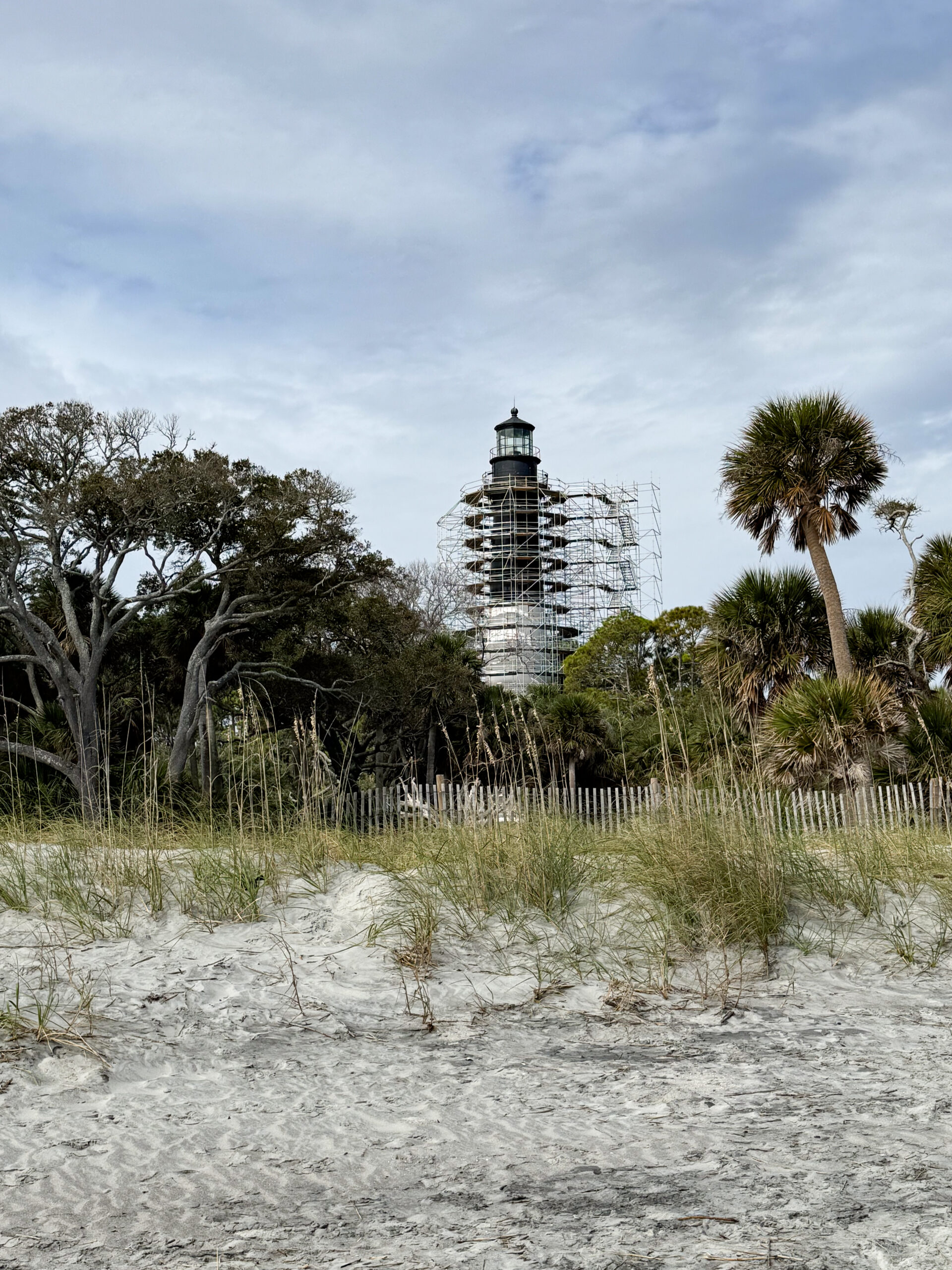 lighthouse-under-restoration-with-coastal-dunes-and-palm-trees-artist-reference-photo