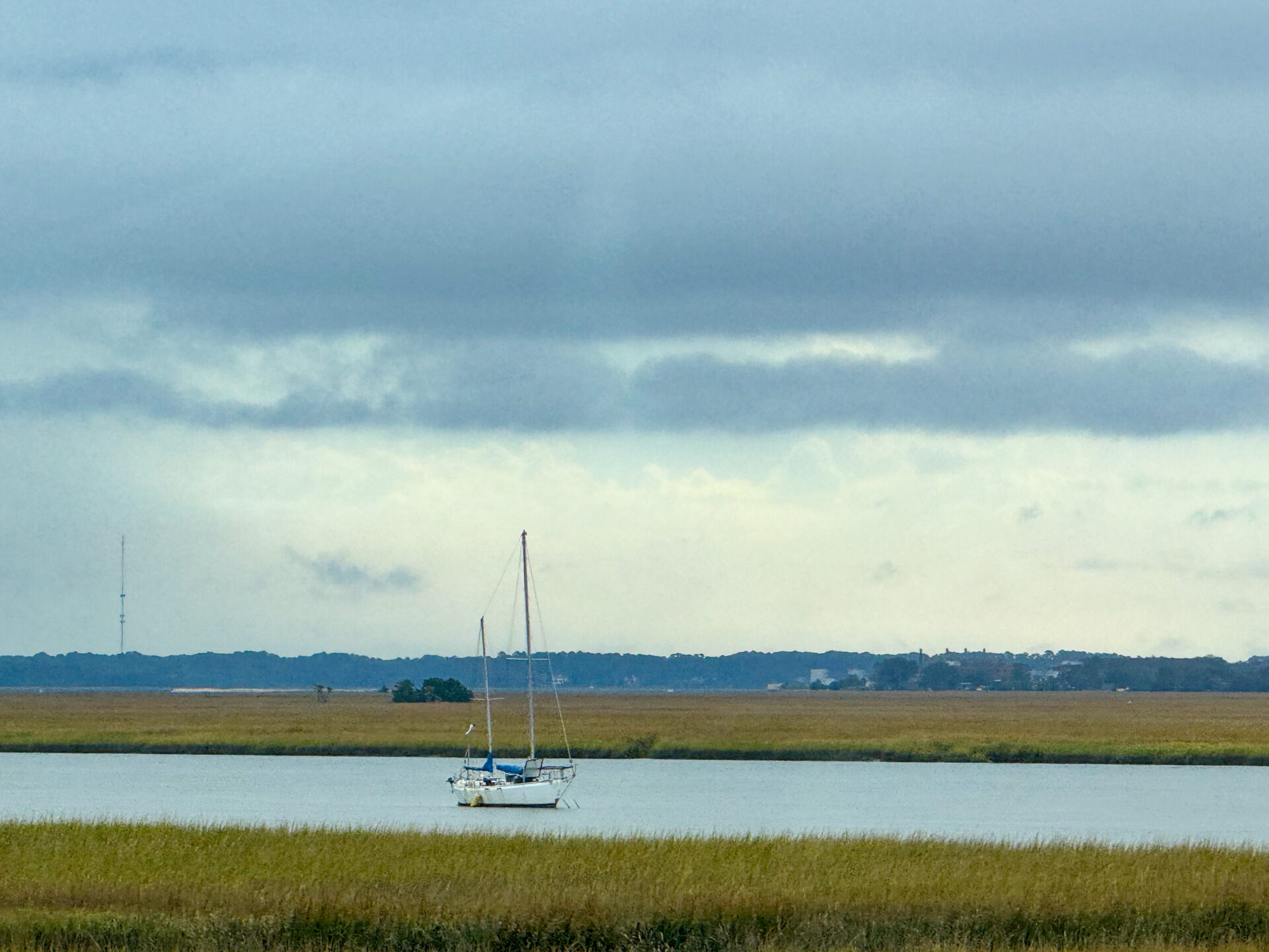 moored-sailboat-on-quiet-marsh-water-with-layered-overcast-sky-artist-reference-photo